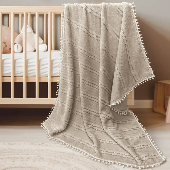 Imagen del producto Cobertor Baby Pom-Pom Caramelo de Regina, con diseño premium y detalles descriptivos